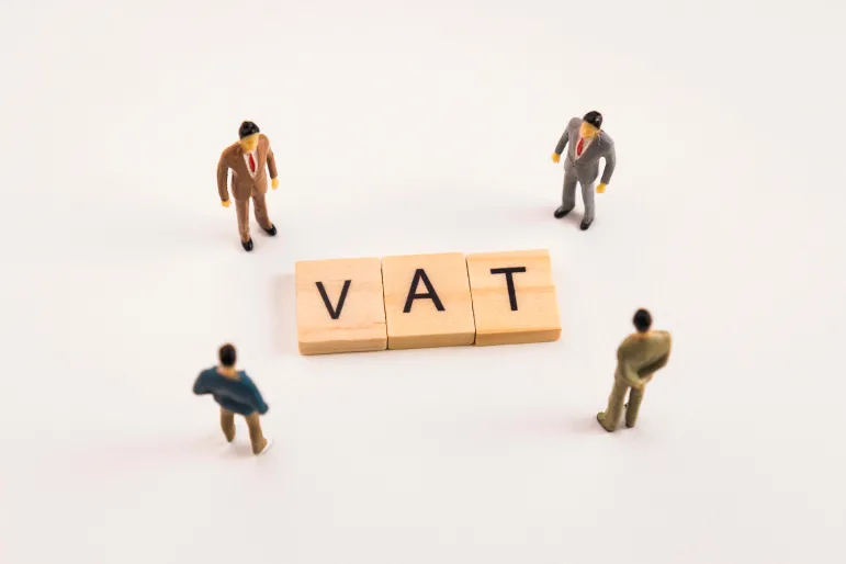 Miniature,Figures,Businessman,:,Meeting,On,Vat,Letters,By,Wooden