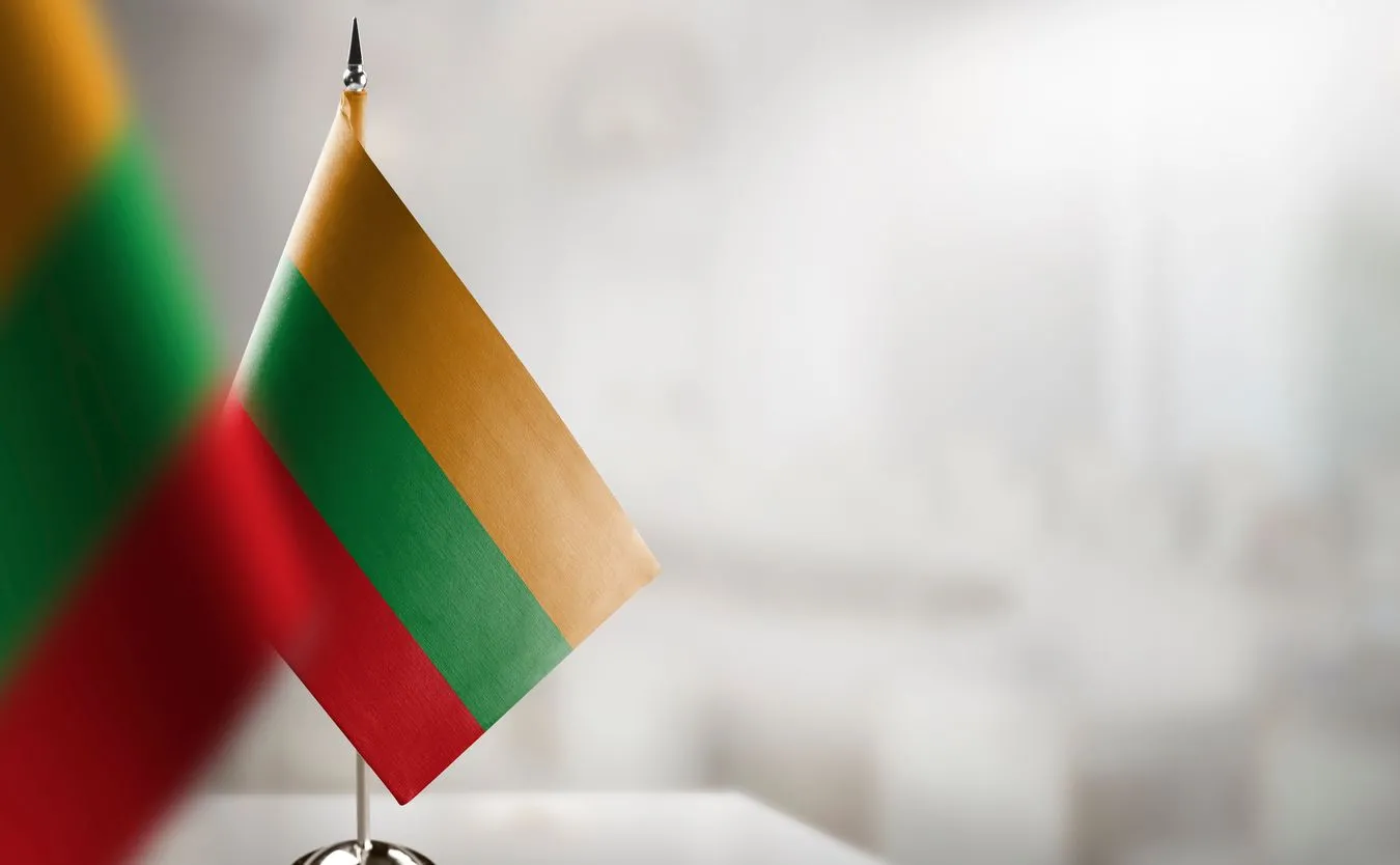 Small,Flags,Of,The,Lithuania,On,An,Abstract,Blurry,Background.