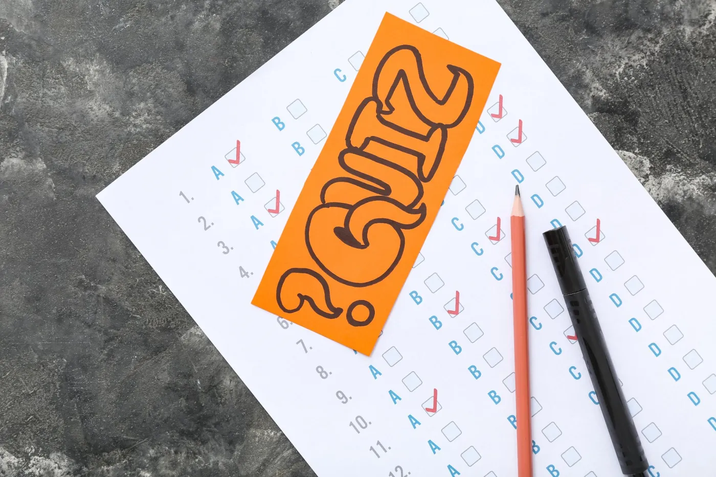 Quiz,Form,With,Card,,Marker,And,Pencil,On,Grunge,Black