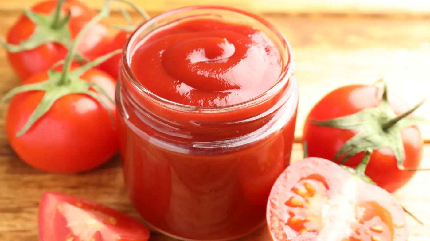 Tasty,Ketchup,And,Tomatoes,On,Wooden,Table,,Closeup