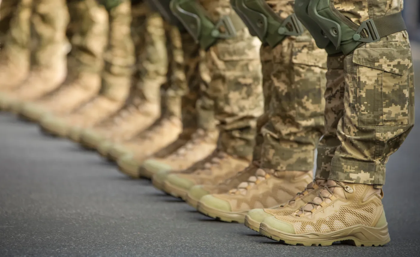 The,Soldiers',Legs,Are,Dressed,In,Ankle,Boots,And,Camouflage