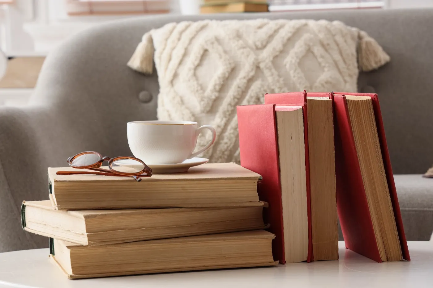 Stack,Of,Old,Books,With,Reading,Glasses,And,A,Cup