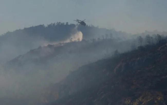 A wildfire burns on Mount Parnitha