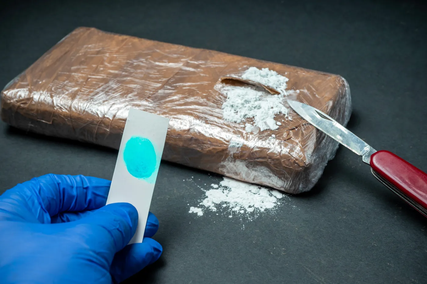 Police,Officer,Hands,Holding,Positive,Cocaine,Drug,Test,Strip.