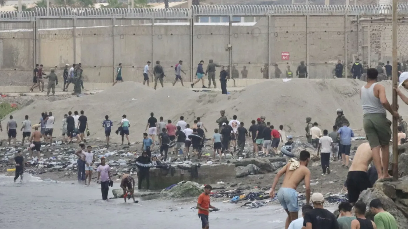Thousands of migrants enter Spanish enclaves in North Africa