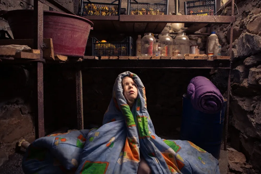 Ukrainian,Kid,Takes,Shelter,In,Her,Basement