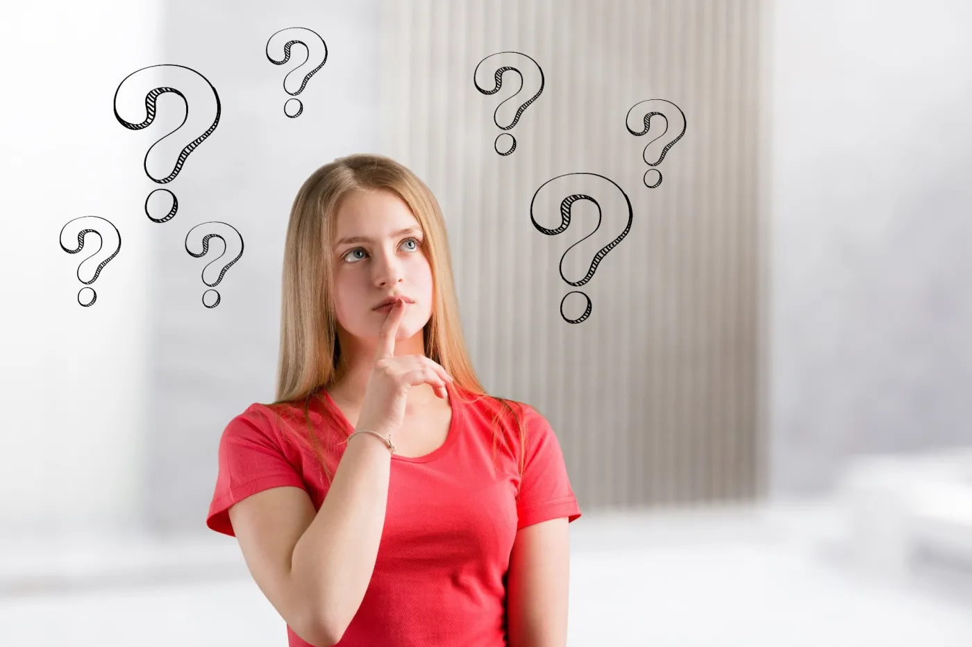 Thinking,Beautiful,Young,Woman,With,Question,Marks