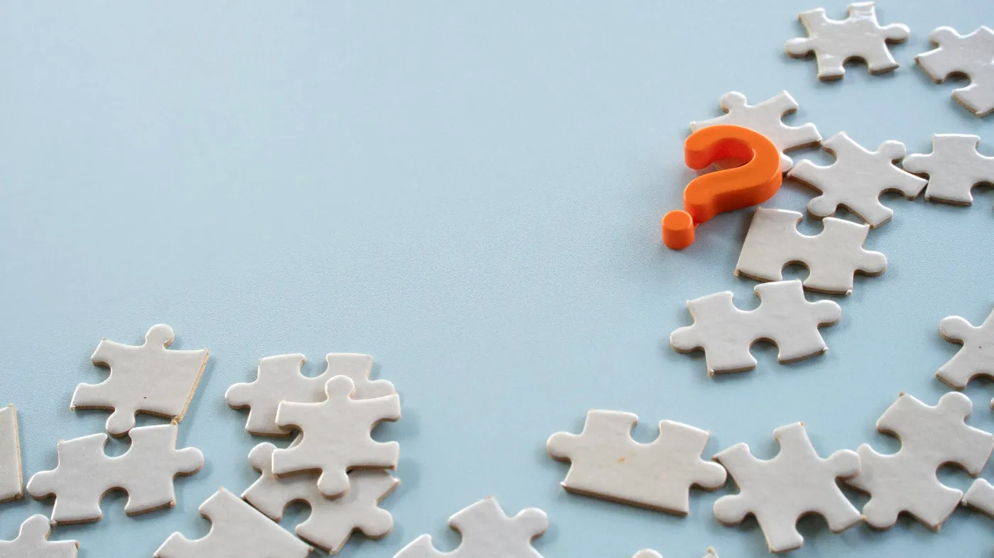 An,Orange,Question,Mark,Symbol,Placed,Over,A,Messy,Cluster