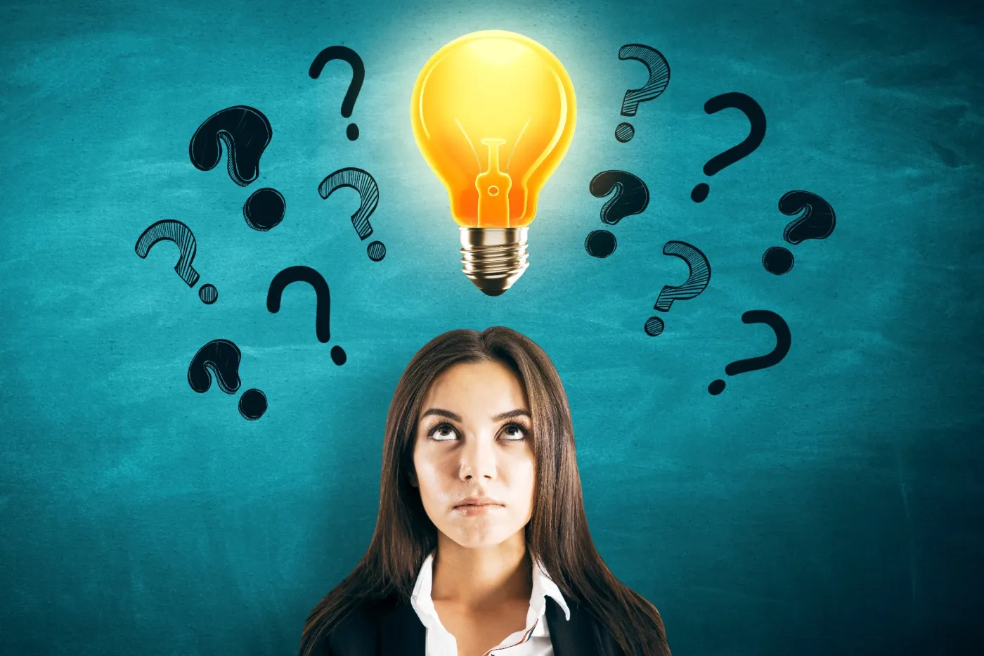 Woman,Staring,At,Lightbulb,Above,Her,Head,With,Question,Marks