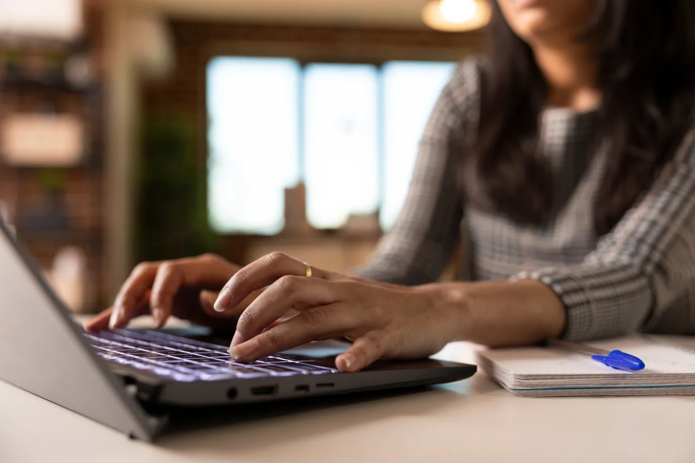 Close,Up,Of,Hands,Typing,On,Laptop,,Shows,Woman,Working