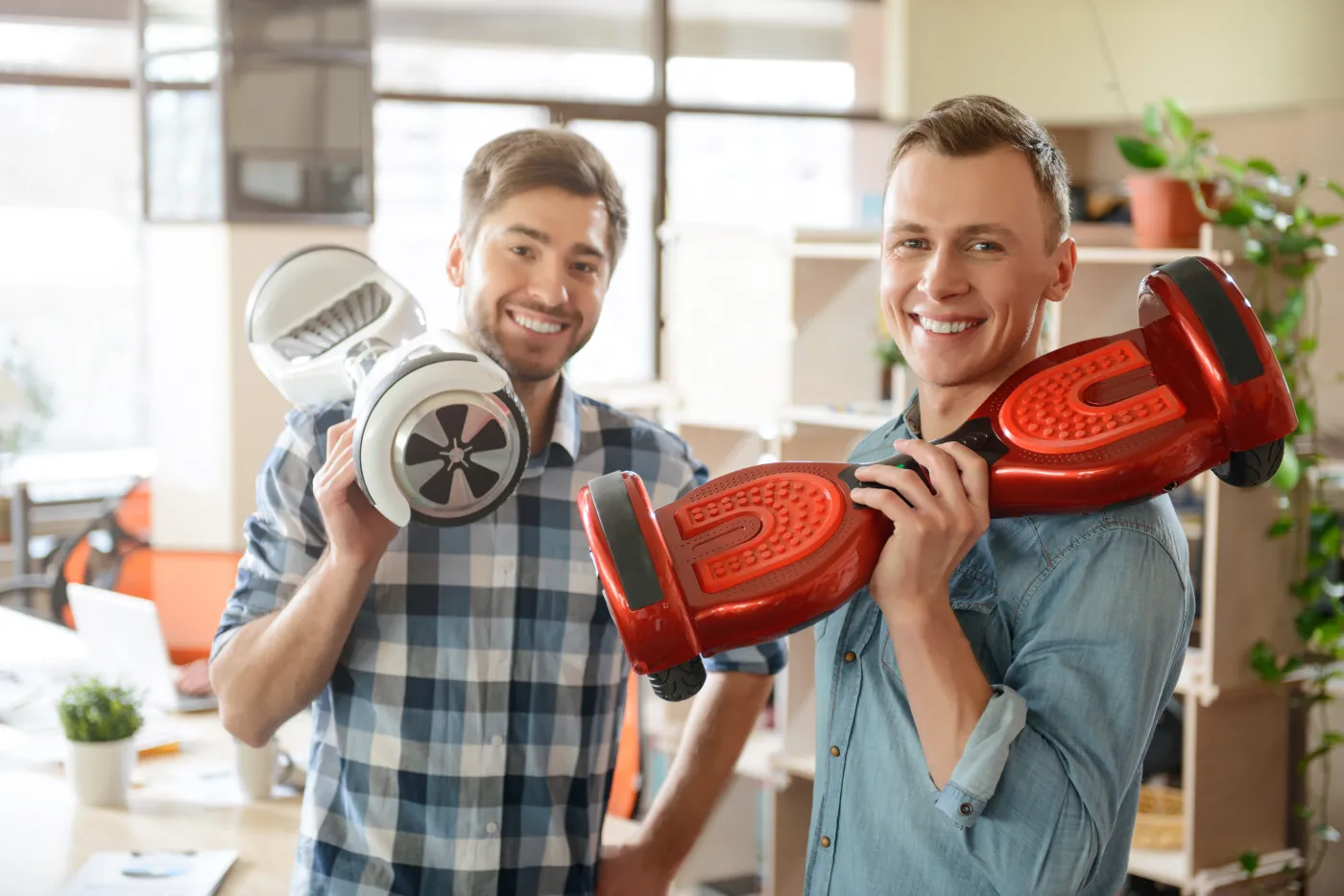 Positive,Smiling,Men,Holding,Gyro,Scooters