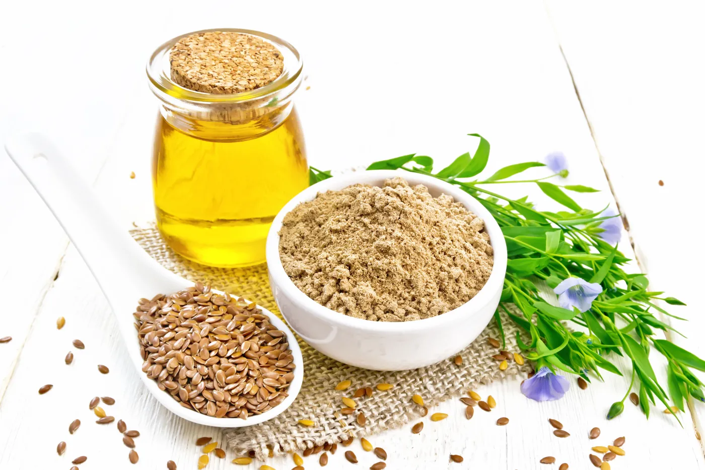 Flaxseed,Flour,In,A,Bowl,,Linenseeds,In,A,Spoon,,Oil