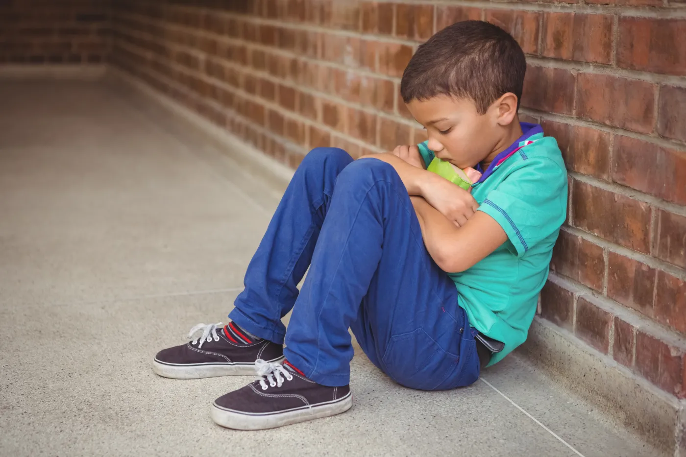Upset,Lonely,Child,Sitting,By,Himself,On,The,Elementary,School