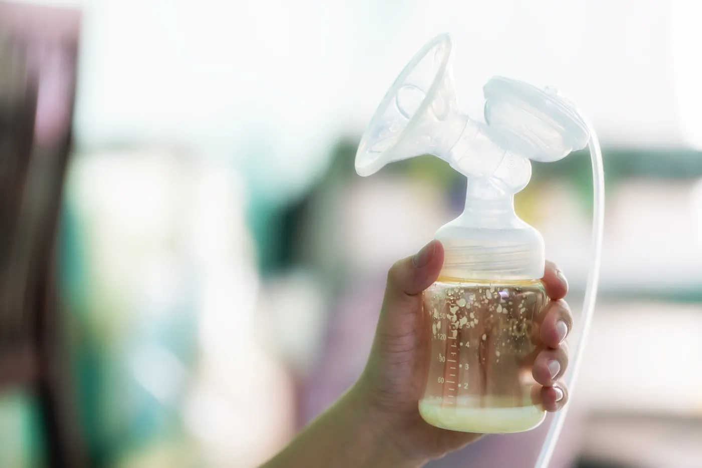 A,Breast,Shield,Is,Attached,To,The,Milk,Bottle,That