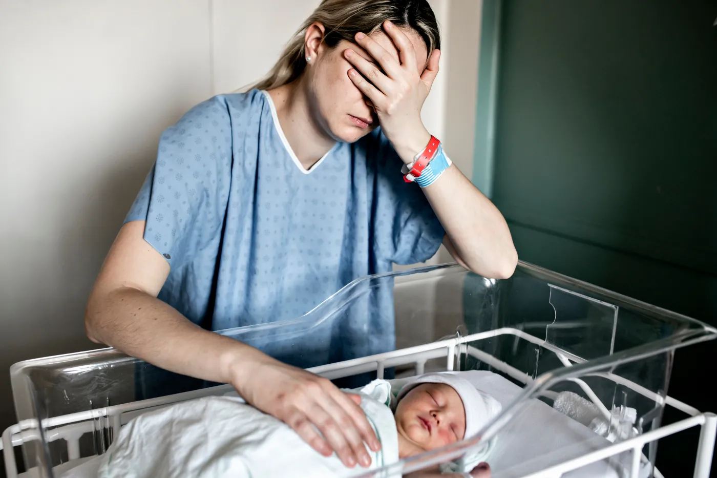 A,Sad,And,Depress,Mother,With,Her,Newborn,Baby,At