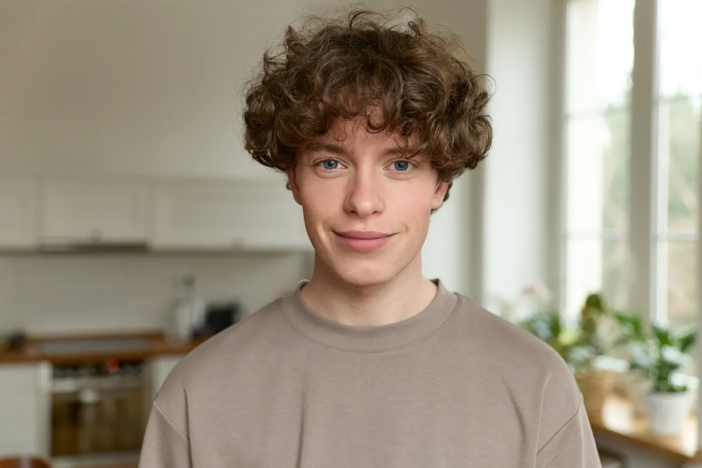 Close,Up,Of,A,Young,Handsome,Positive,Curly,Man,With