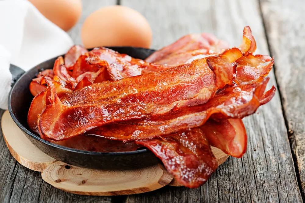 Hot,Fried,Bacon,Pieces,In,A,Cast,Iron,Skillet.top,View