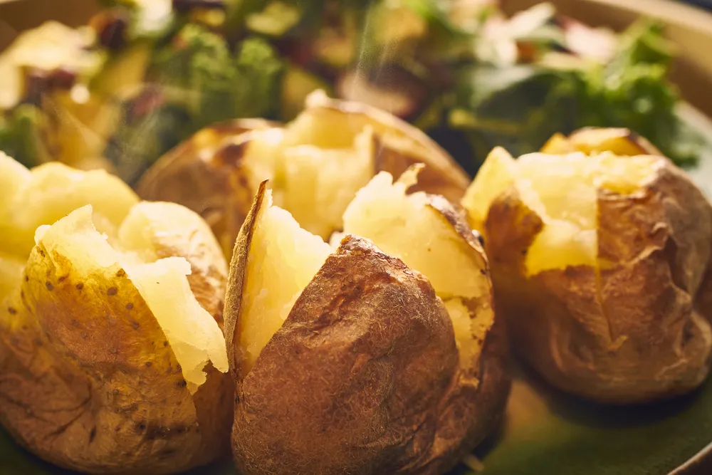 Hot,Buttered,Jacket,Baked,Potatoes,Close,Up,With,Steam