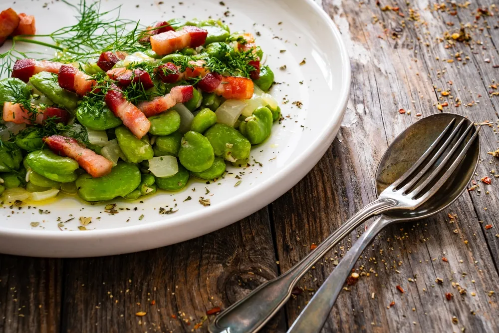 Broad,Beans,With,Garlic,,Dill,And,Bacon,On,Wooden,Table