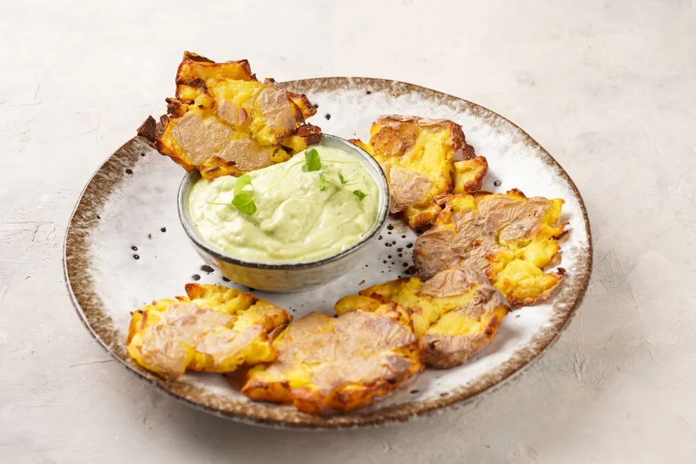 Trendy,Comfort,Snack,Crispy,Roasted,Crushed,Potatoes,On,A,Round
