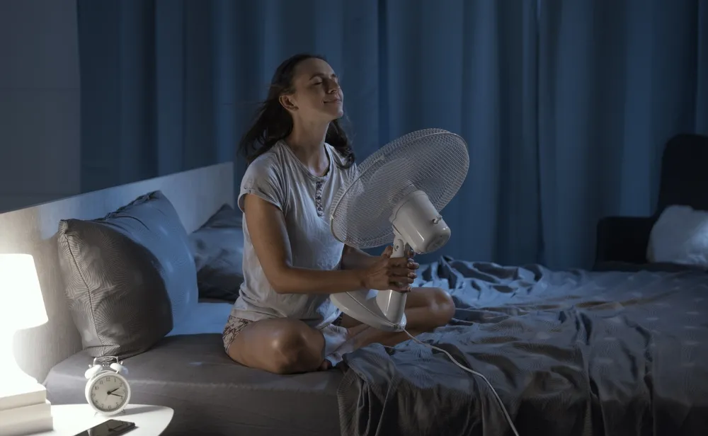 Woman,In,Her,Bedroom,On,A,Hot,Summer,Night,,She