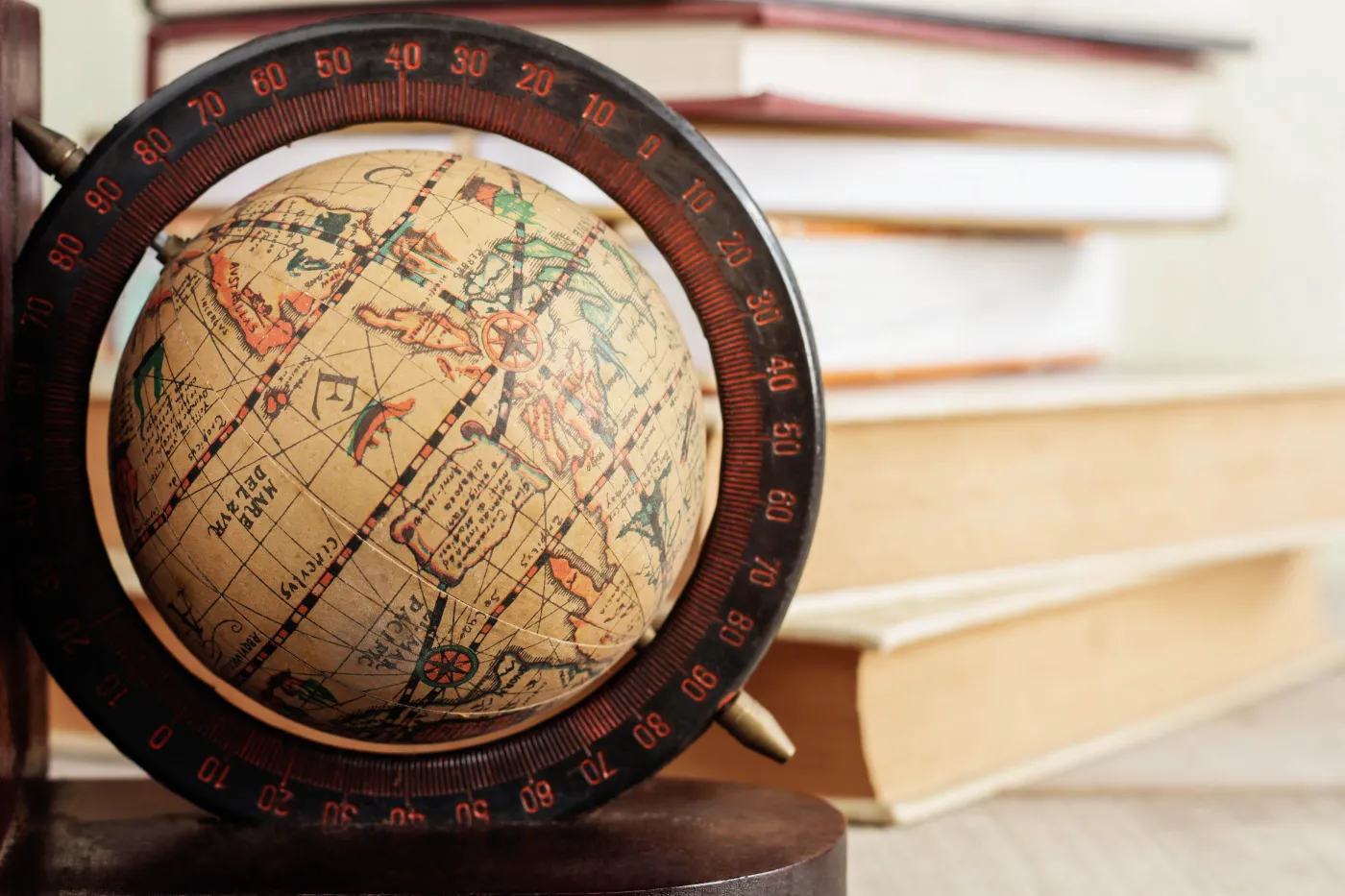 Globe,And,Books,On,Floor,Of,Library.