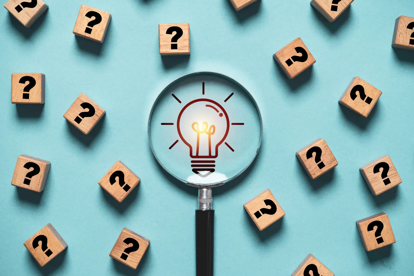 Glowing,Light,Bulb,Inside,Magnifier,Glass,Among,Question,Mark,For