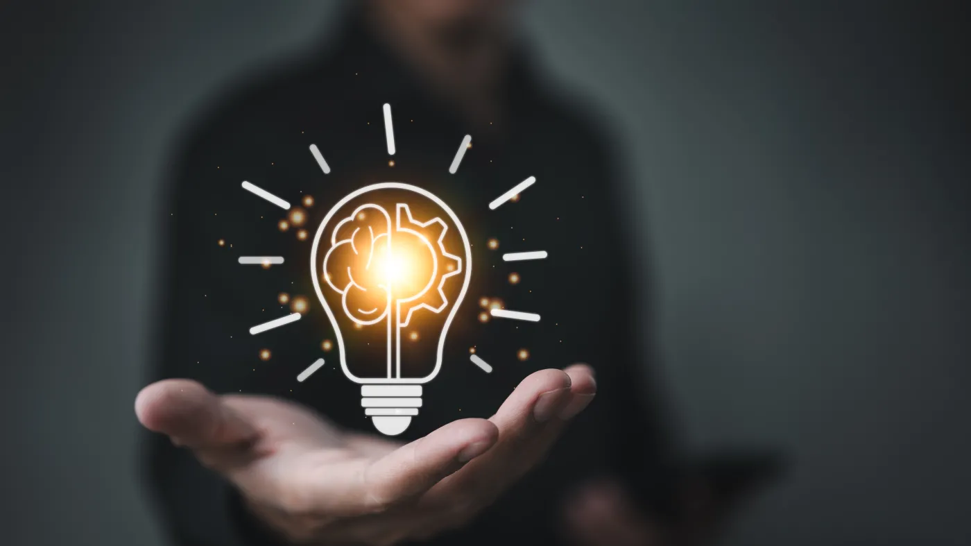 Creative,Idea,Concept.,Businessman,Holding,Light,Bulb,And,Brain,Inside.