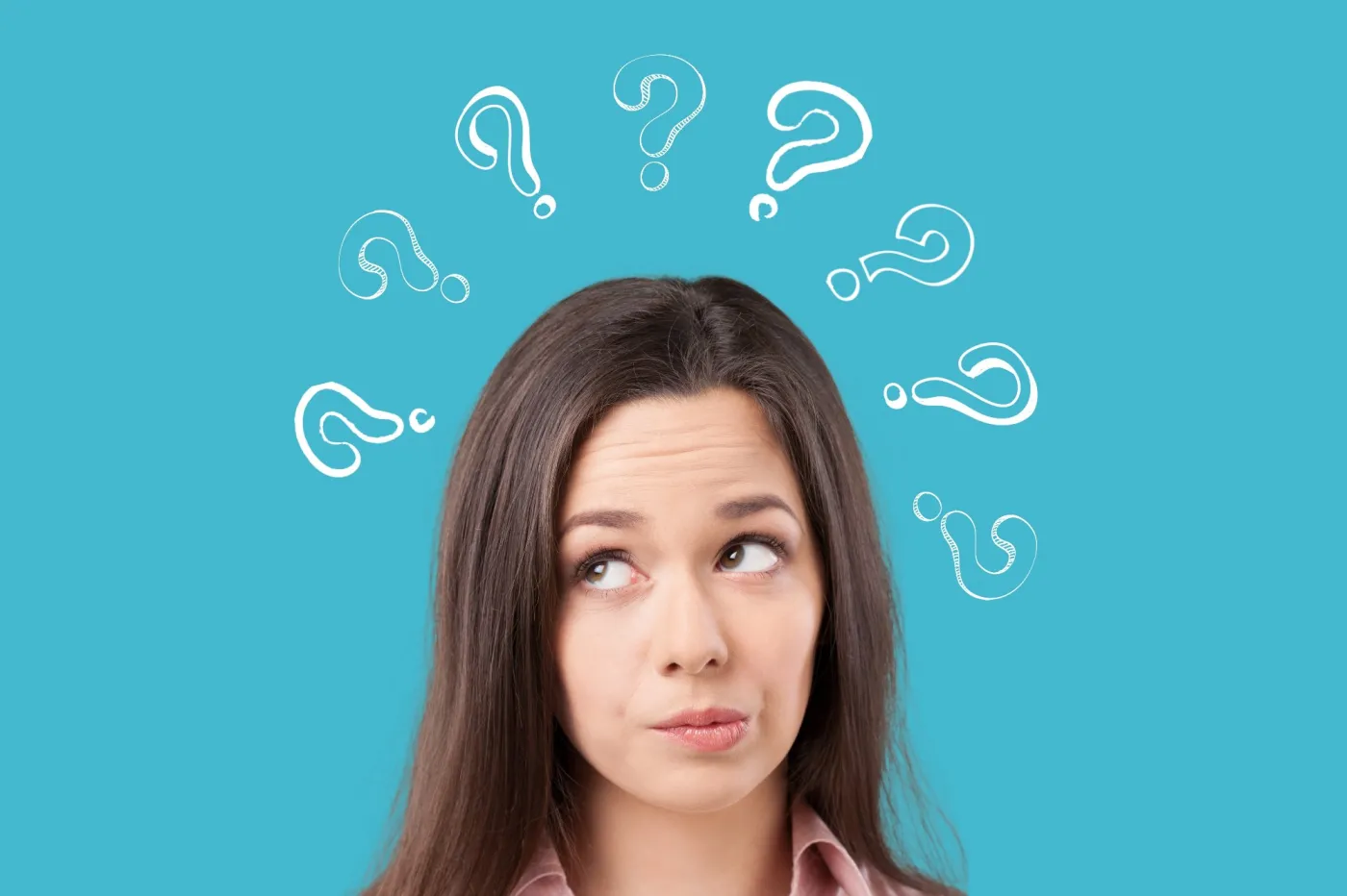 Thinking,Smile,Woman,With,Questions,Marks,On,The,Background