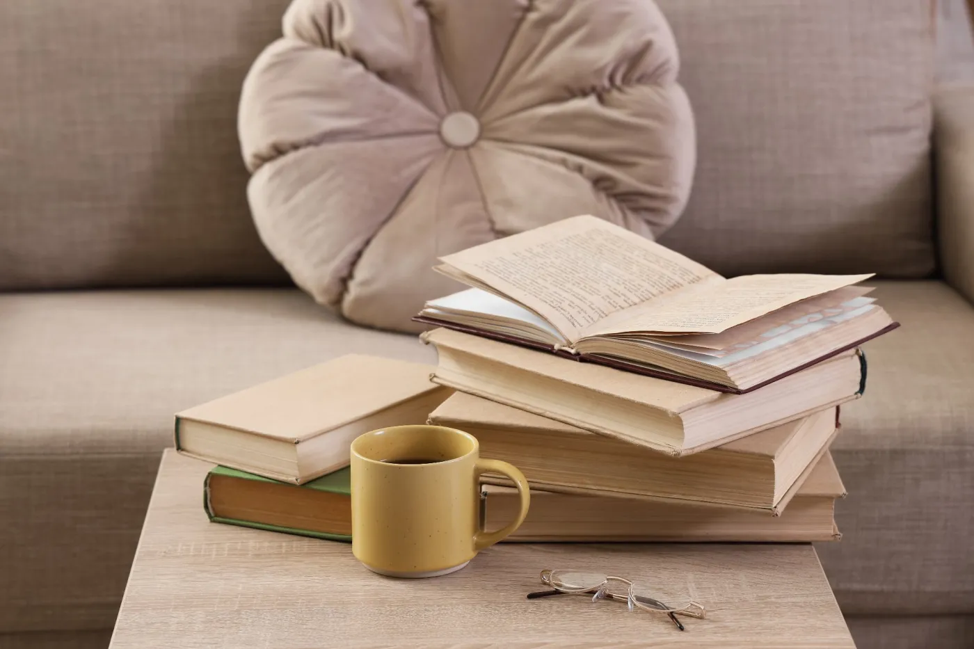 Stack,Of,Old,Books,With,An,Open,Book,,Coffee,Mug,