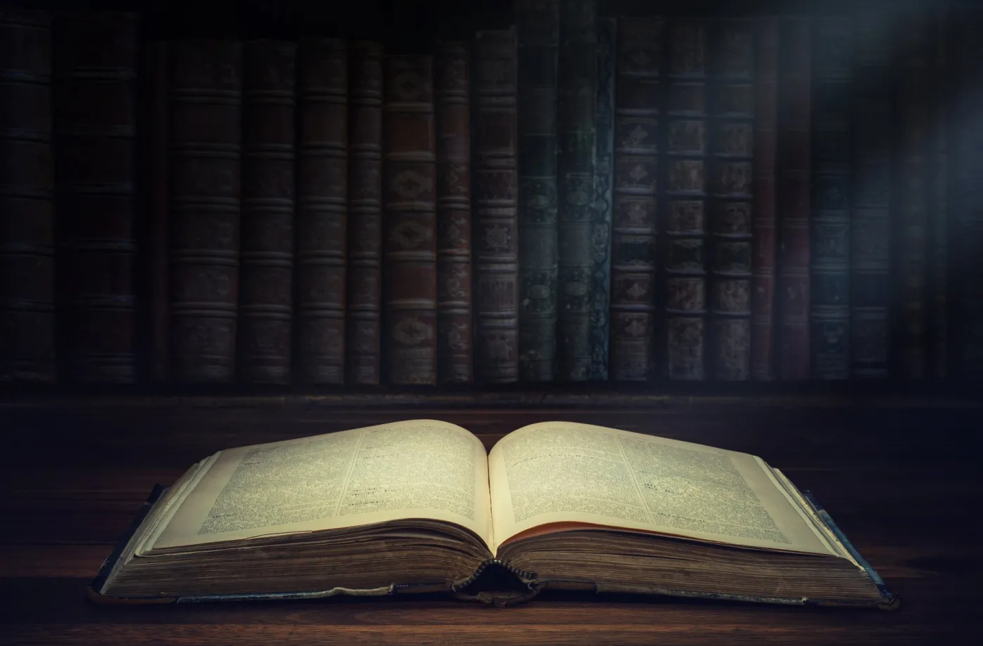 Open,Old,Book,On,A,Bookshelf,Background.,Selective,Focus.,Conceptual