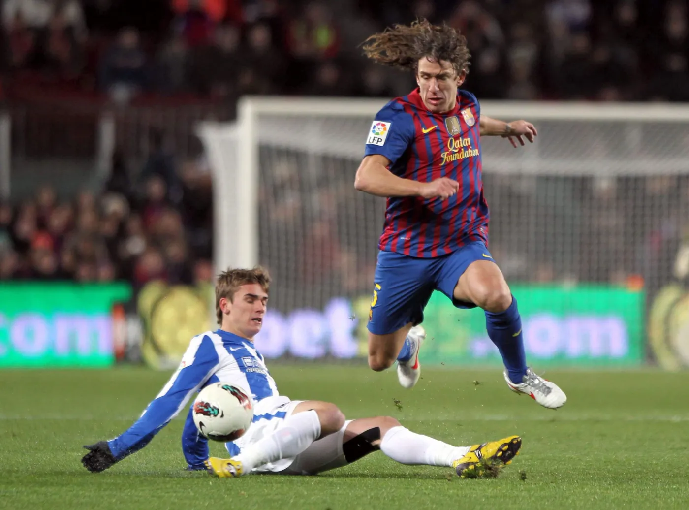 Carles Puyol i Antoine Griezmann