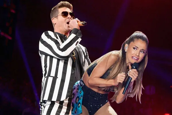 7235576-ariana-grande-potracona-skrzydlem.jpg