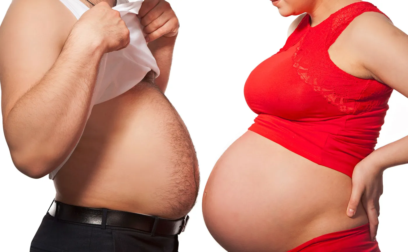 Brzuch kobiety w ciąży i mężczyzny