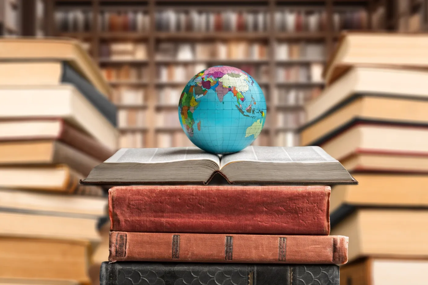 Old,Globe,On,Open,Book,In,Modern,Library.