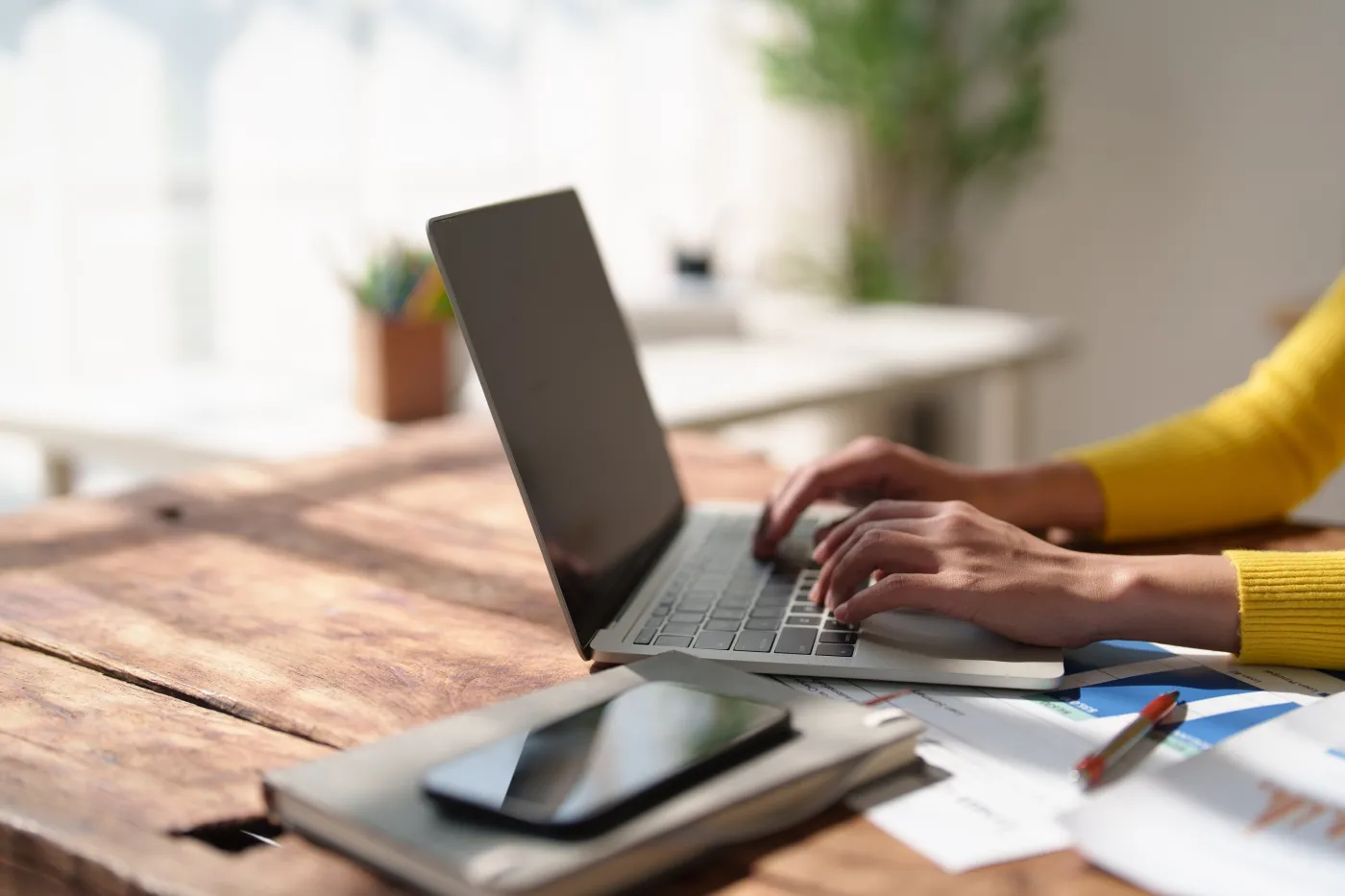 Person,Hands,Wearing,A,Yellow,Sweater,Typing,On,A,Laptop