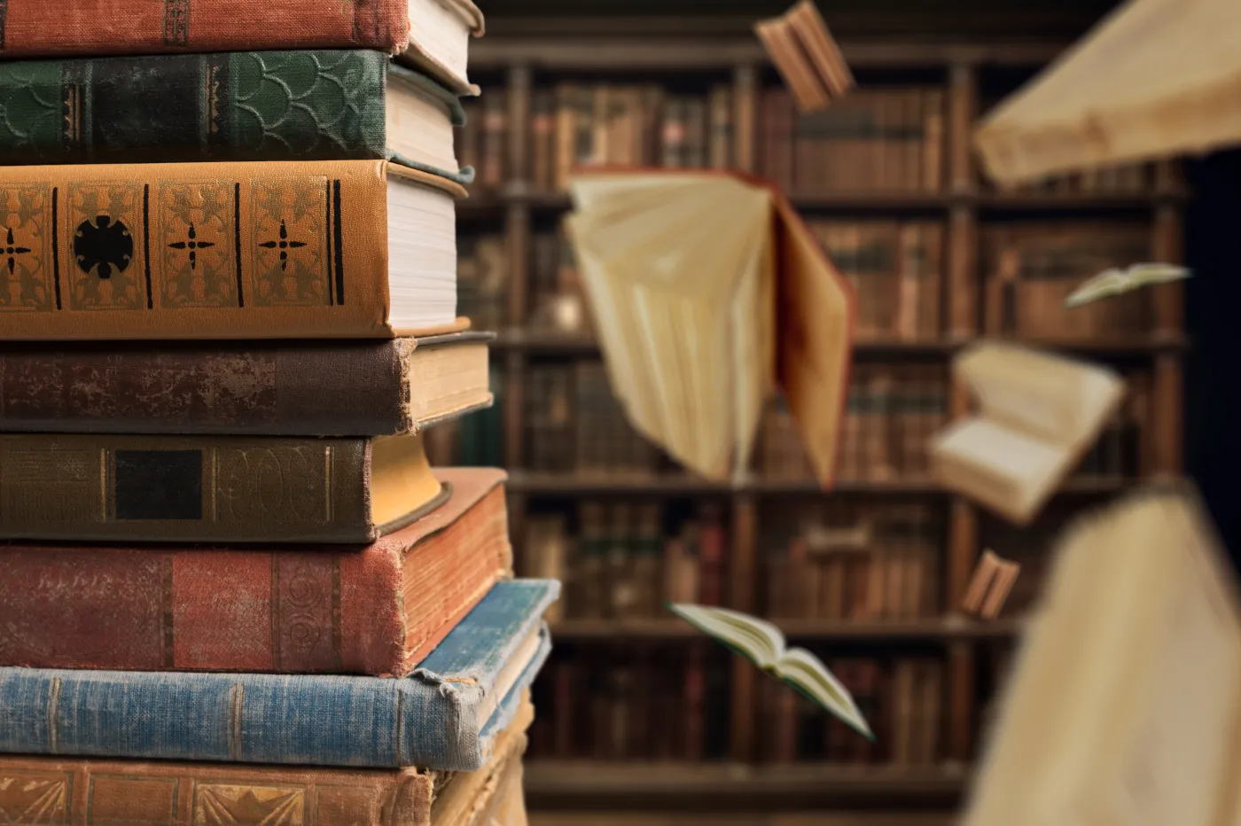 A,Stack,Of,Old,Reading,Books,And,Flying,Pages