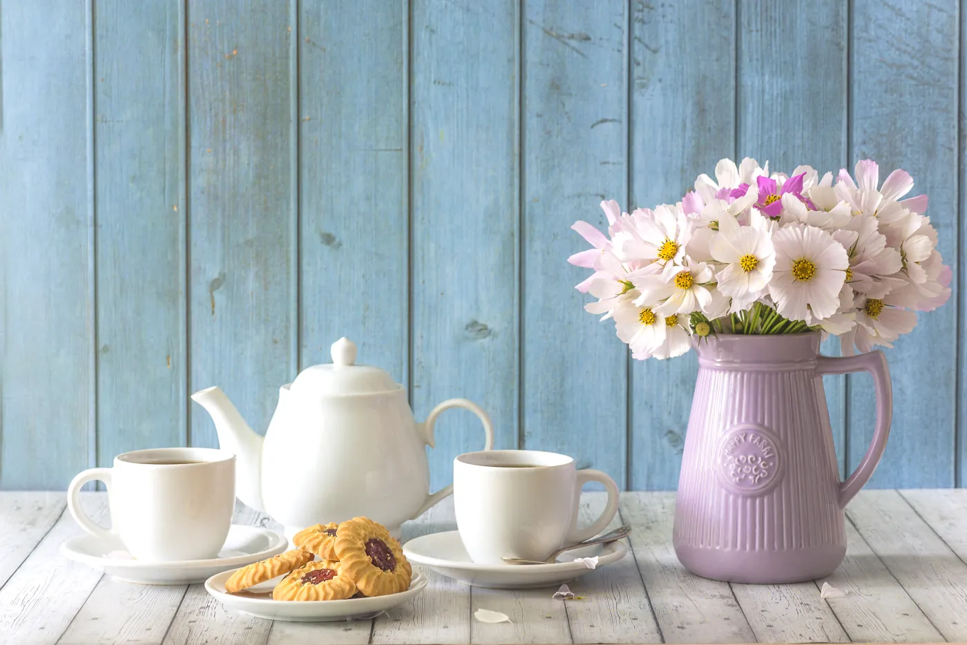 Two,White,Cups,Of,Tea,,Tea,Pot,,Cookies,And,Bouquet