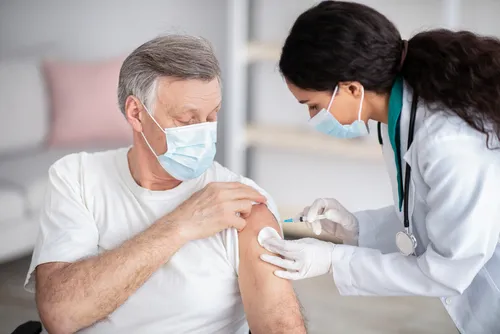 Immunizing,Homebound,Patients,With,Covid-19,Vaccine.,Young,Doctor,Giving,Injection