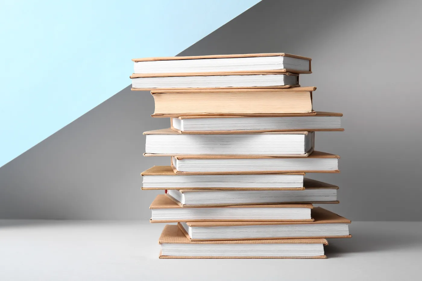 Stack,Of,Books,On,Colorful,Background