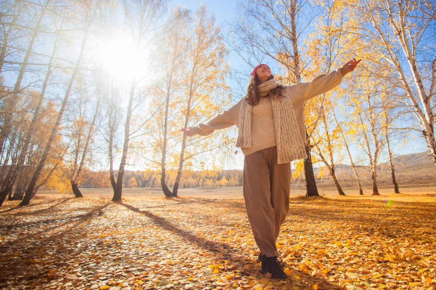Woman,Walking,In,Autumn,Forest,With,Arms,Outstretched.,Happy,Girl
