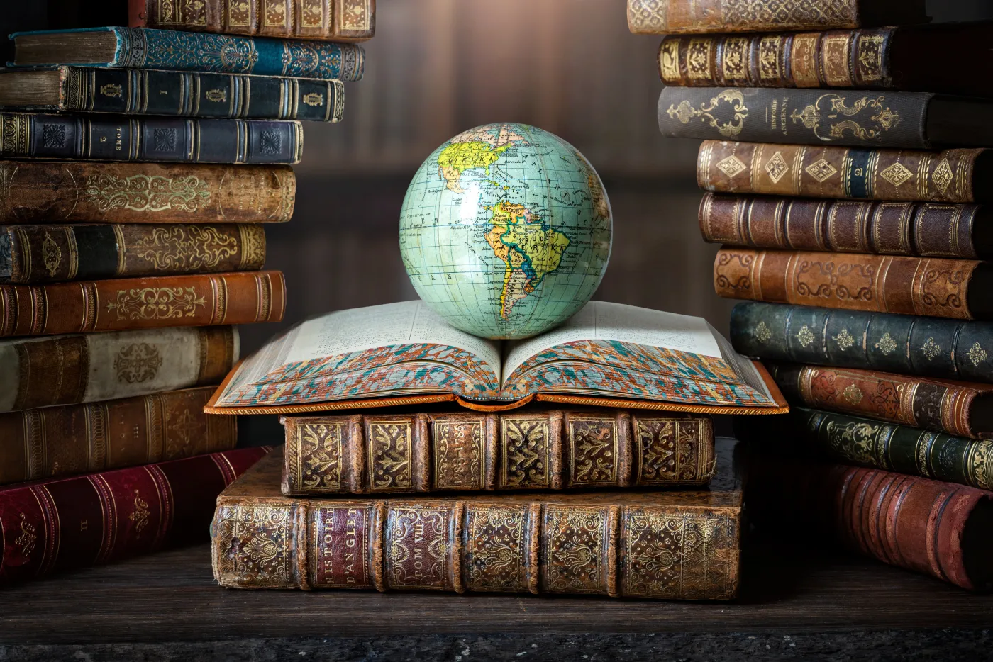 Old,Globe,Lying,On,An,Open,Book,In,A,Library.