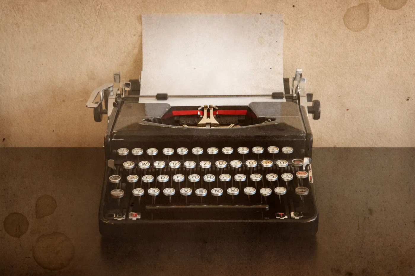 Vintage,Mechanical,Typewriter,On,Aged,Textured,Background,,Concept,Of,Writing,