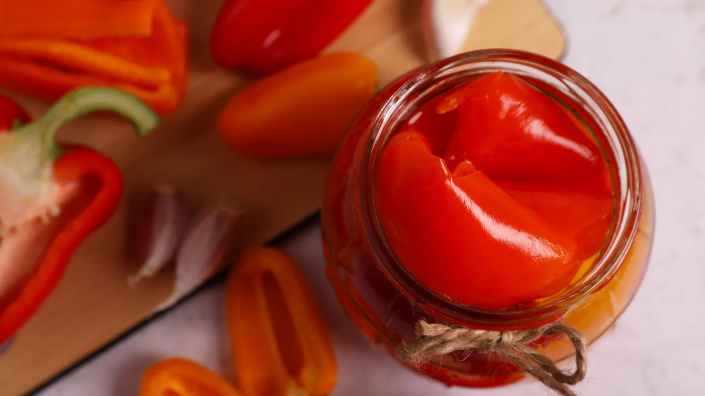 Jar,With,Tasty,Pickled,Peppers,And,Fresh,Vegetables,On,Table,