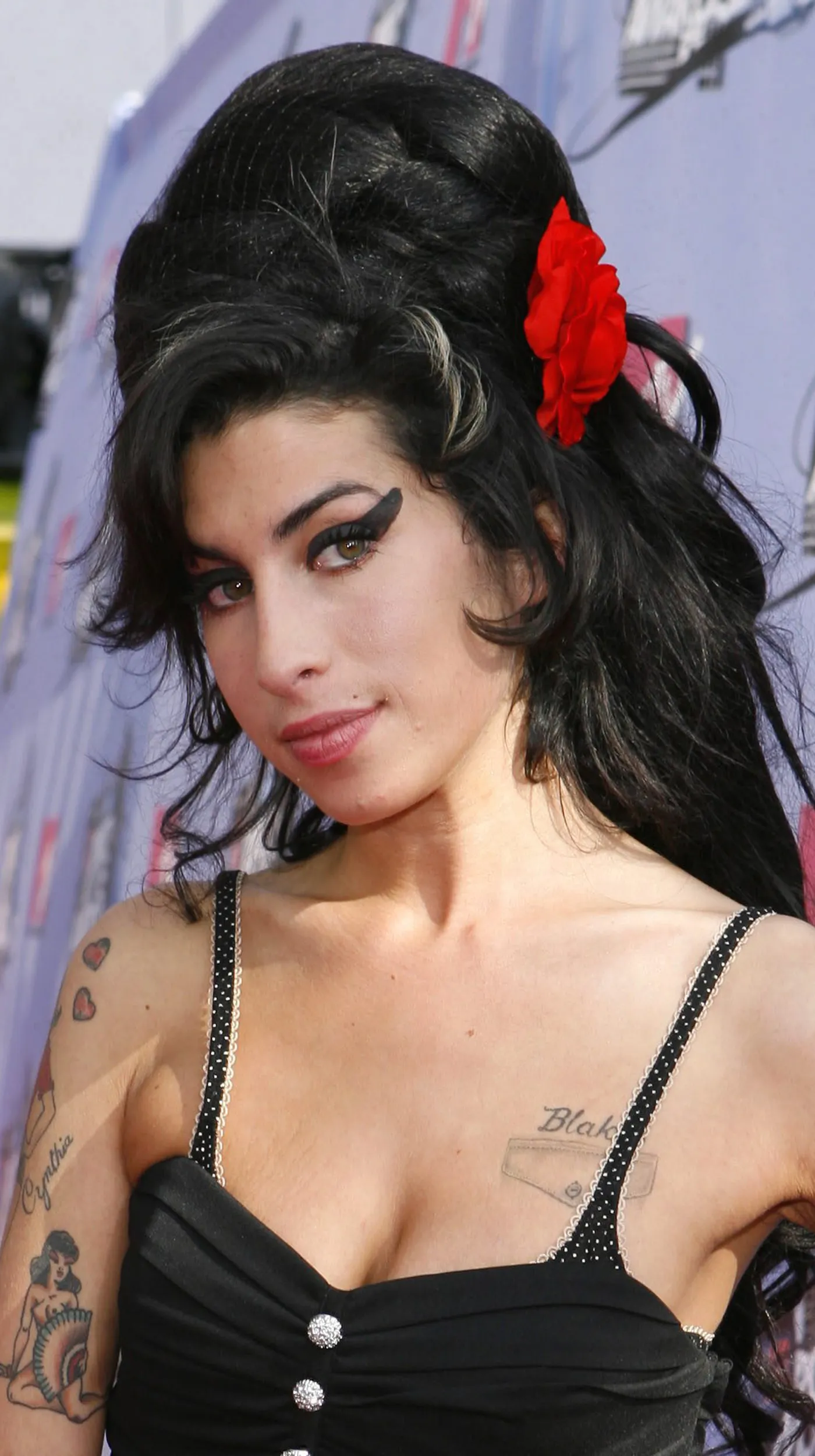  FILE  Singer Amy Winehouse arrives at the MTV Movie Awards in Los Angeles, in this June 3, 2007, file photo. Winehouse has canceled all concerts and public appearances for the rest of the year on the advice of her doctor.   quot;The rigors involved in touring and the intense emotional strain that Amy has been under in recent weeks have taken their toll, quot; said Tracey Miller, the 24-year-old British soul singer apos;s representative, in a statement Tuesday, Nov. 27, 2007.  AP PhotoKevork Djansezian, file