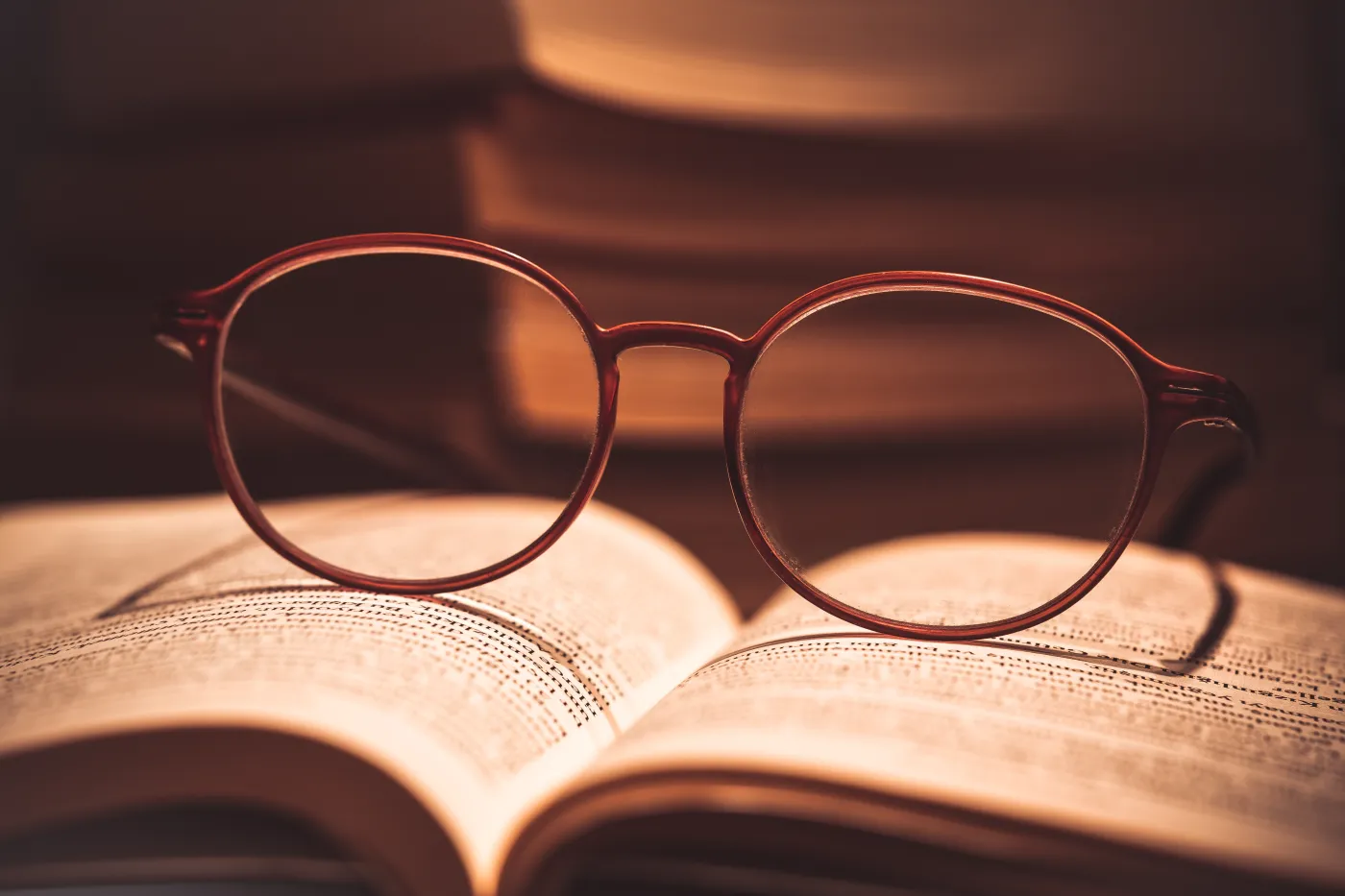 Reading,Glasses,Selective,Focus.,There,Are,Books,Stacked,On,Top