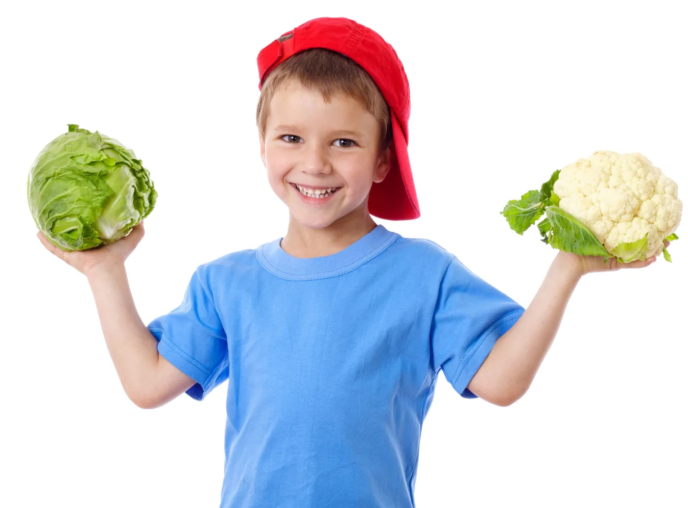 Chłopiec trzyma warzywa