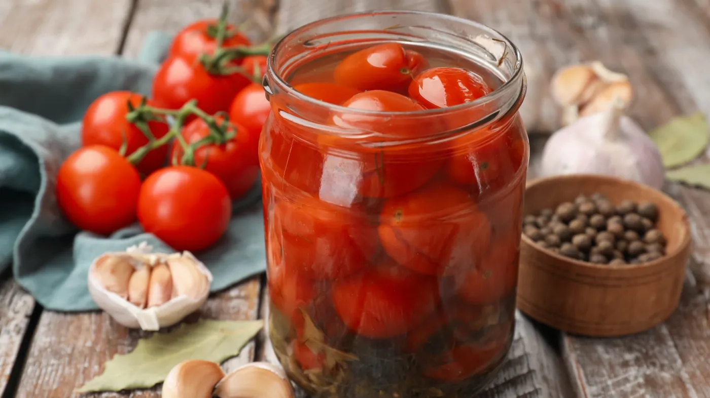 Tasty,Pickled,Tomatoes,In,Jar,And,Ingredients,On,Wooden,Table,