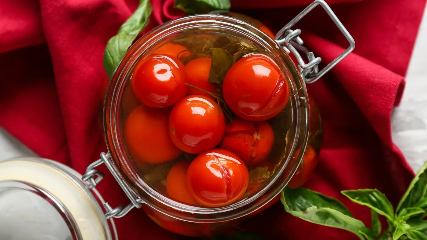 Jar,Of,Canned,Tomatoes,With,Basil,And,Napkin,On,White