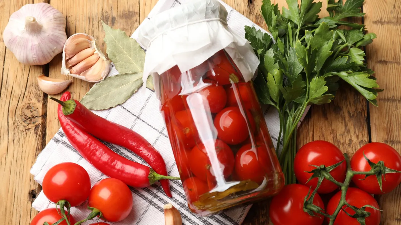 Tasty,Pickled,Tomatoes,In,Jar,And,Ingredients,On,Wooden,Table,